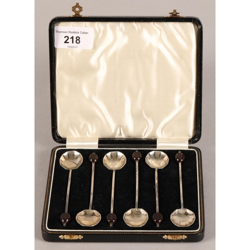 218 - Set of six silver bean end coffee spoons, cased.