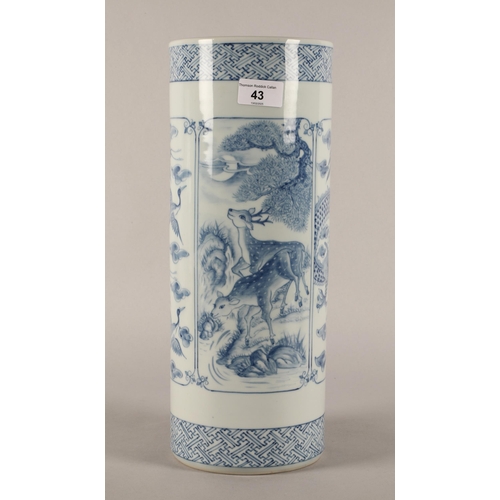 43 - Oriental blue and white cylindrical vase decorated with panels of animals, signed to base. 37cm