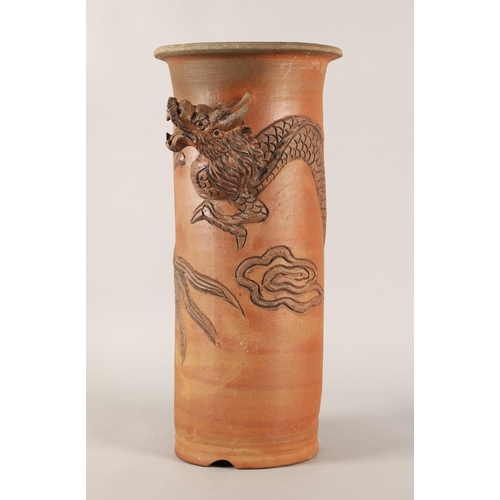 244 - Japanese terracotta umbrella stand decorated in relief with dragon. 58cm