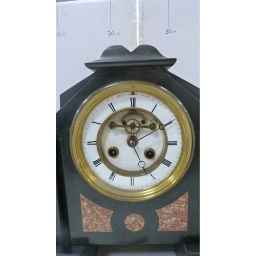 104 - Victorian black slate and marble mantel clock with twin train dial.