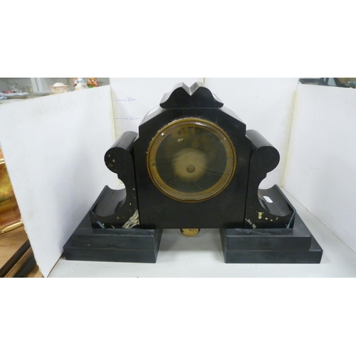 104 - Victorian black slate and marble mantel clock with twin train dial.