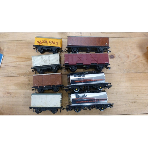 14 - Three boxes containing assorted rolling stock, track etc.