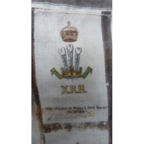 28 - Silk panel of various regimental crests, later framed and glazed.