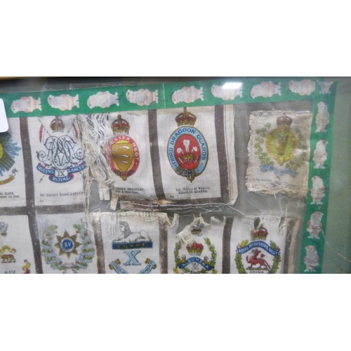 28 - Silk panel of various regimental crests, later framed and glazed.