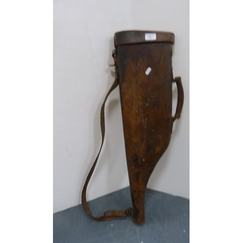 33 - Hide leg o'mutton gun case, initialled, with shoulder strap, and a bottle rack.  (2)