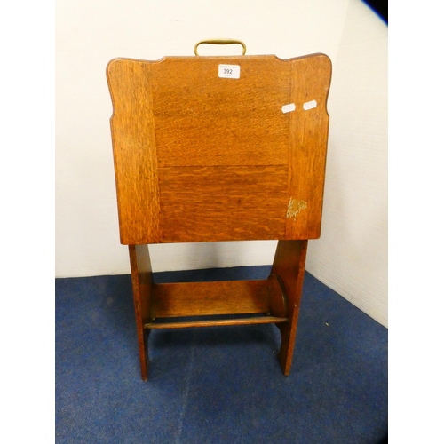 392 - Oak magazine table with brass handle.