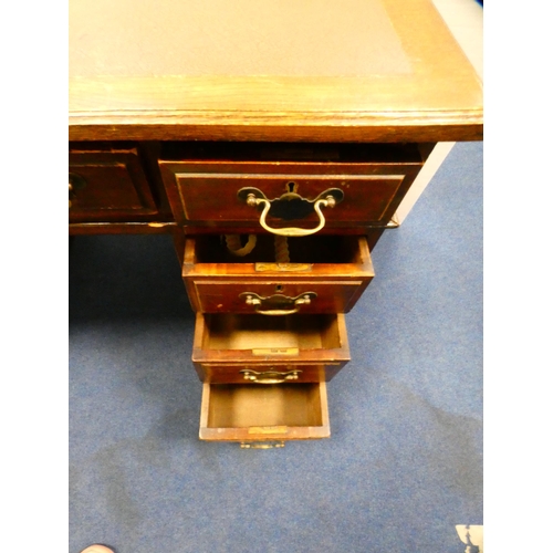 394 - Oak kneehole desk with secretaire drawer.