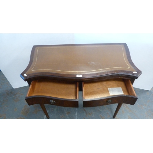 395 - Reproduction folding card table with serpentine tooled top.