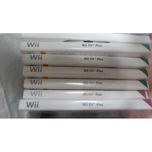 63 - Bag containing Nintendo Wii games to include Wii Fit and Wii Fit Plus etc.