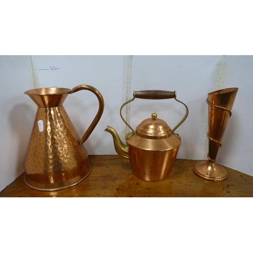 67 - Copper and brassware to include a large pair of brass candlesticks, copper jug, Indian gu-shaped vas... 