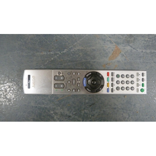 77 - Sony television and remote control.