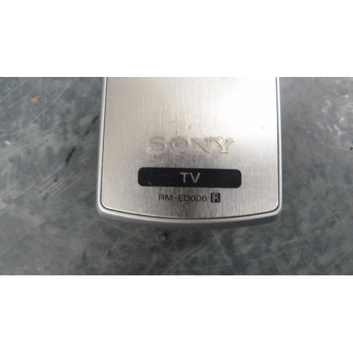 77 - Sony television and remote control.