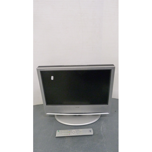 79 - Sony Bravia television and remote control and a Dell monitor.  (2)