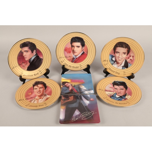 351 - Collection of Elvis Presley collector plates and Elvis clock