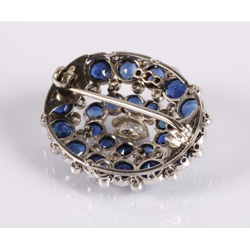 99 - White metal brooch set with diamonds and sapphires, 8.6g, 3cm x 2.5cm