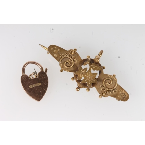 550 - 9ct gold heart lock closure and a 9ct gold floral brooch, 4.7g.