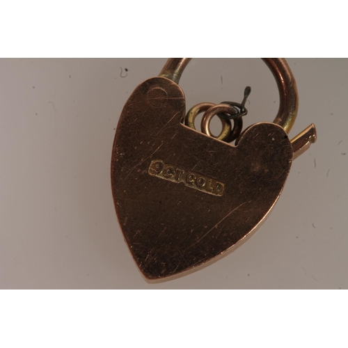 550 - 9ct gold heart lock closure and a 9ct gold floral brooch, 4.7g.