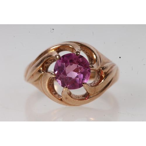 552 - 14kt gold ladies dress ring set with pink stone, 6.2g.