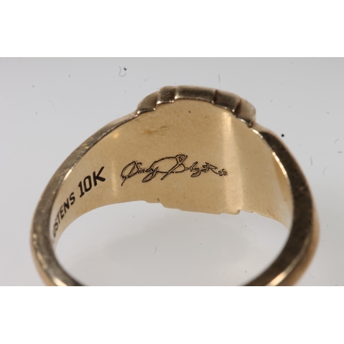 555 - Yellow metal dress ring, stamped Jostens 10k.