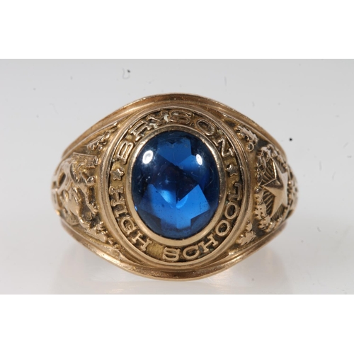 556 - Yellow metal Bryson high school ring, set with blue stone, stamped 10k.