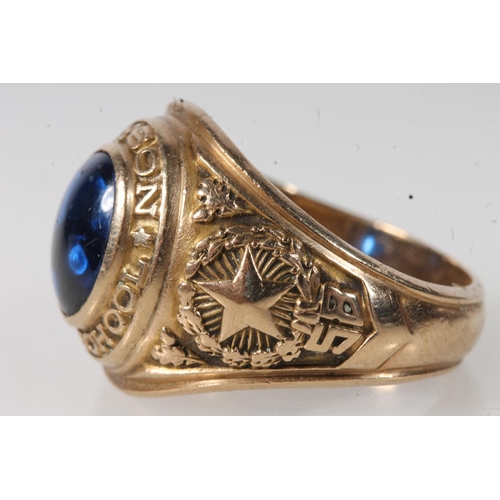 556 - Yellow metal Bryson high school ring, set with blue stone, stamped 10k.