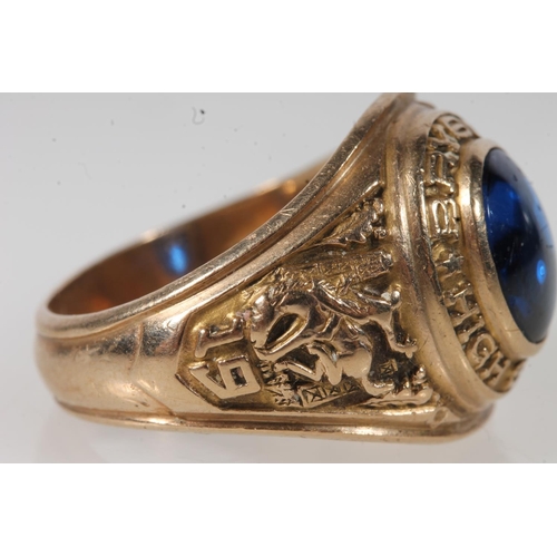 556 - Yellow metal Bryson high school ring, set with blue stone, stamped 10k.