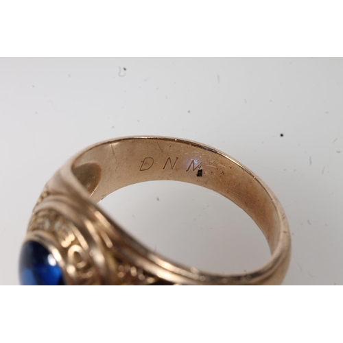 556 - Yellow metal Bryson high school ring, set with blue stone, stamped 10k.