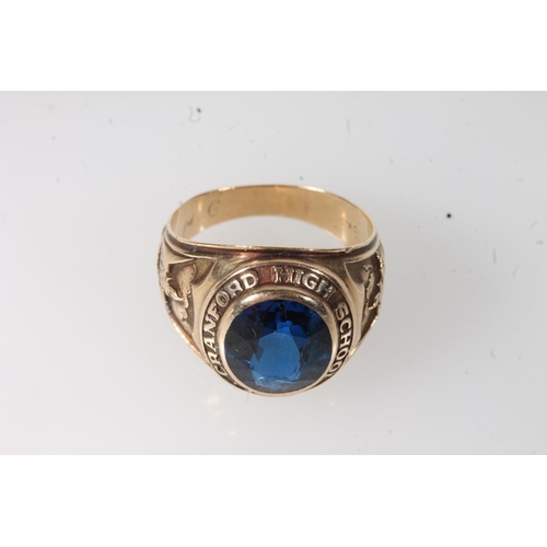 557 - Yellow metal Cranford high school ring, set with blue stone, stamped 10k.