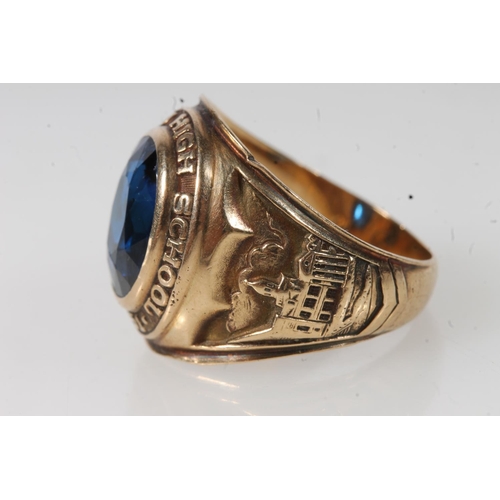 557 - Yellow metal Cranford high school ring, set with blue stone, stamped 10k.