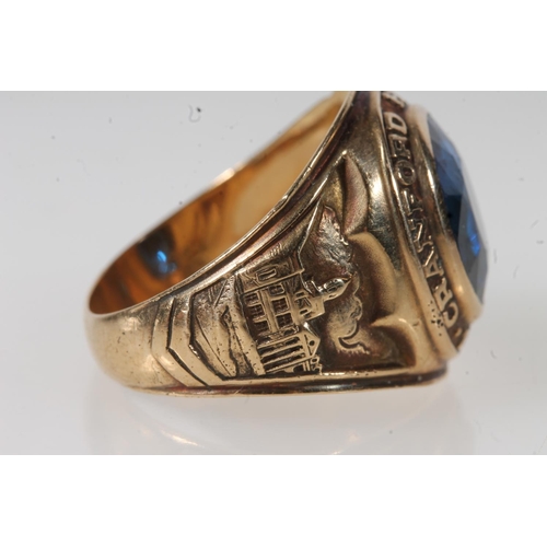 557 - Yellow metal Cranford high school ring, set with blue stone, stamped 10k.