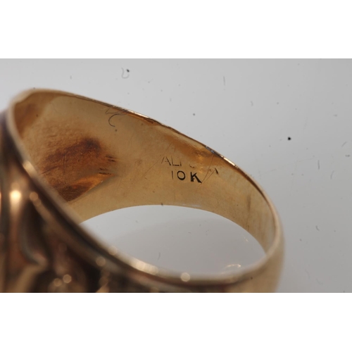 557 - Yellow metal Cranford high school ring, set with blue stone, stamped 10k.