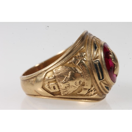 559 - Yellow metal gents ring set with decorated central pink stone, stamped 10K.