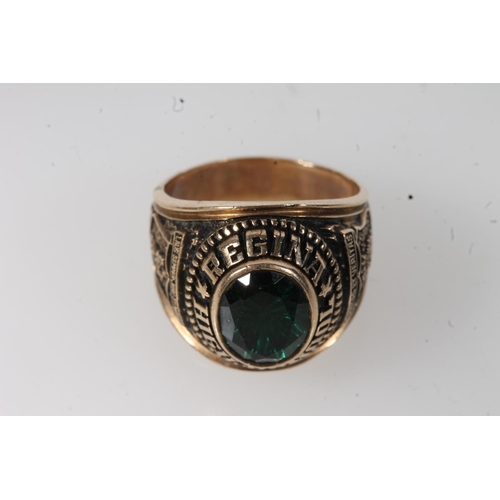 561 - Yellow metal Regina high school ring, set with green stone, stamped 10k.