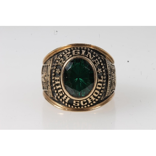 561 - Yellow metal Regina high school ring, set with green stone, stamped 10k.