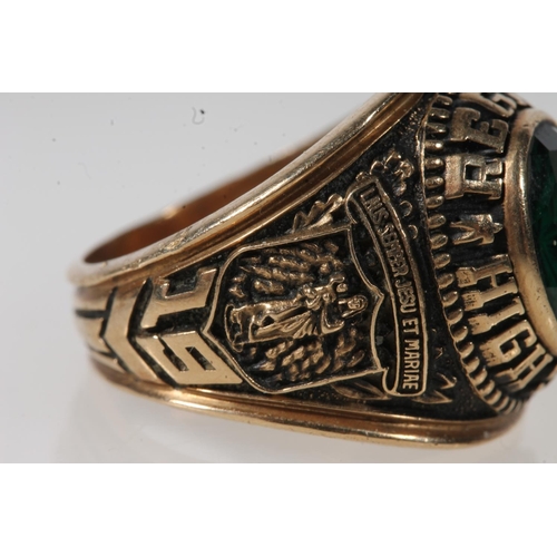 561 - Yellow metal Regina high school ring, set with green stone, stamped 10k.