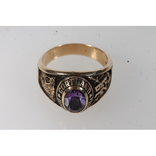 562 - Yellow metal Cortland high school ring, set with purple stone, stamped 10k.