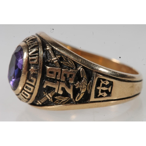 562 - Yellow metal Cortland high school ring, set with purple stone, stamped 10k.