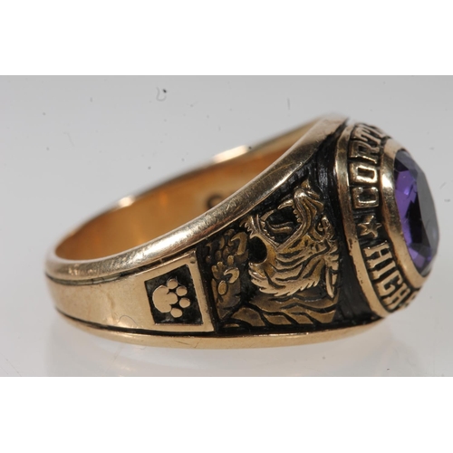 562 - Yellow metal Cortland high school ring, set with purple stone, stamped 10k.