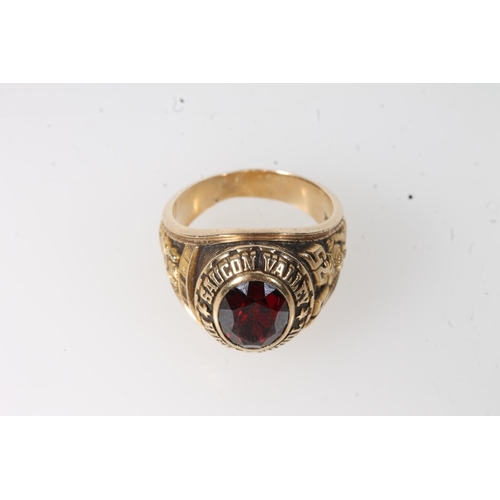 563 - Yellow metal Saucon Valley high school ring, set with red stone, stamped 10k.