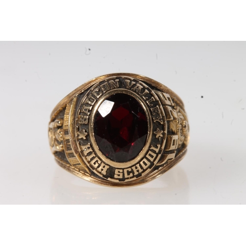 563 - Yellow metal Saucon Valley high school ring, set with red stone, stamped 10k.