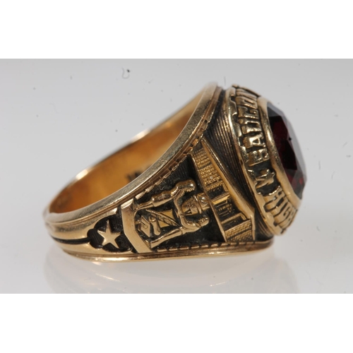 563 - Yellow metal Saucon Valley high school ring, set with red stone, stamped 10k.