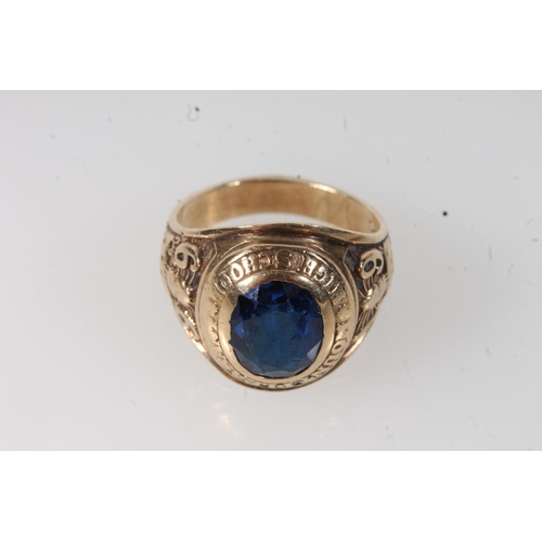 565 - Yellow metal mount pleasant high school ring, set with blue stone, stamped 10k.