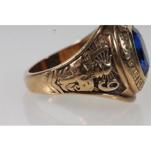 565 - Yellow metal mount pleasant high school ring, set with blue stone, stamped 10k.