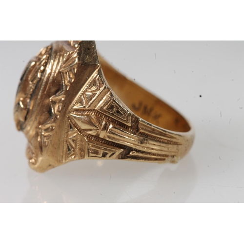 568 - Yellow metal American graduation ring, stamped 10k.