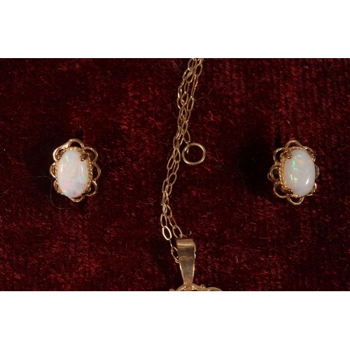 582 - 9k gold opal suite of jewellery comprising opal pendant on chain and matching earrings, 2.8g.