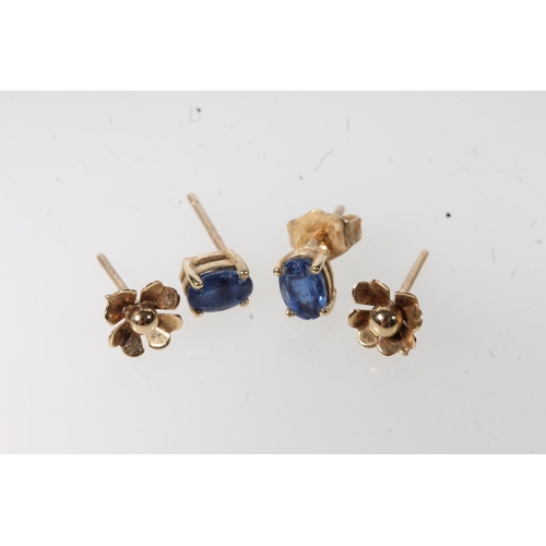 586 - A pair of blue stone set 9ct gold earrings and another pair with floral decoration, 1.5g.