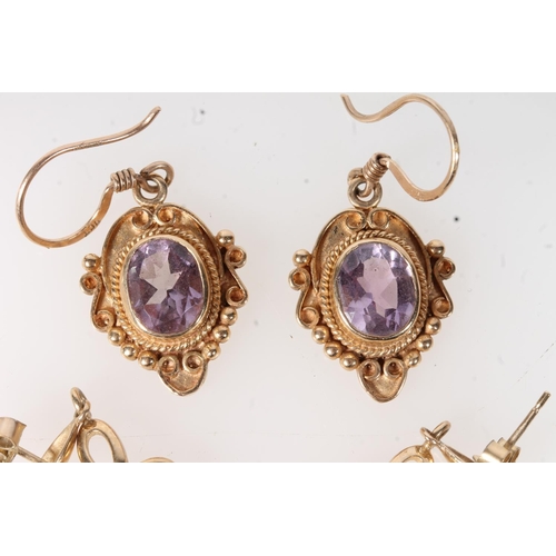 635 - Two pairs of 9ct gold amethyst set earrings, 10.1g.