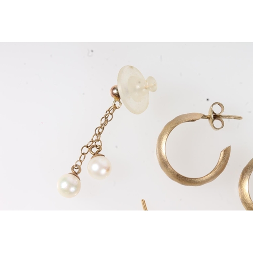 648 - Three pairs of yellow mental earrings and an individual earring. 