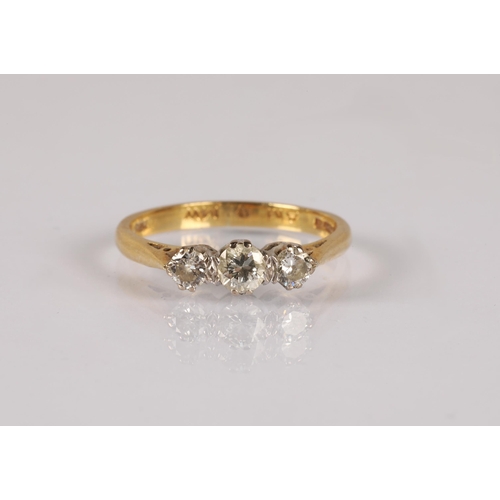 120 - 18ct gold ring set with a trio of diamonds, ring size M, 2.6g