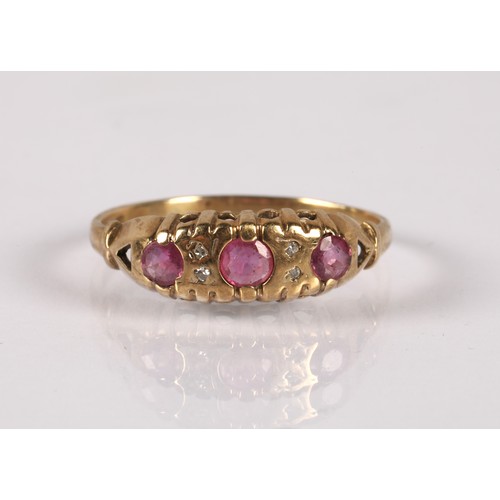 122 - 9ct gold ring set with pink gemstones and diamond chips, ring size M/N, 1.5g, with a yellow metal ba... 